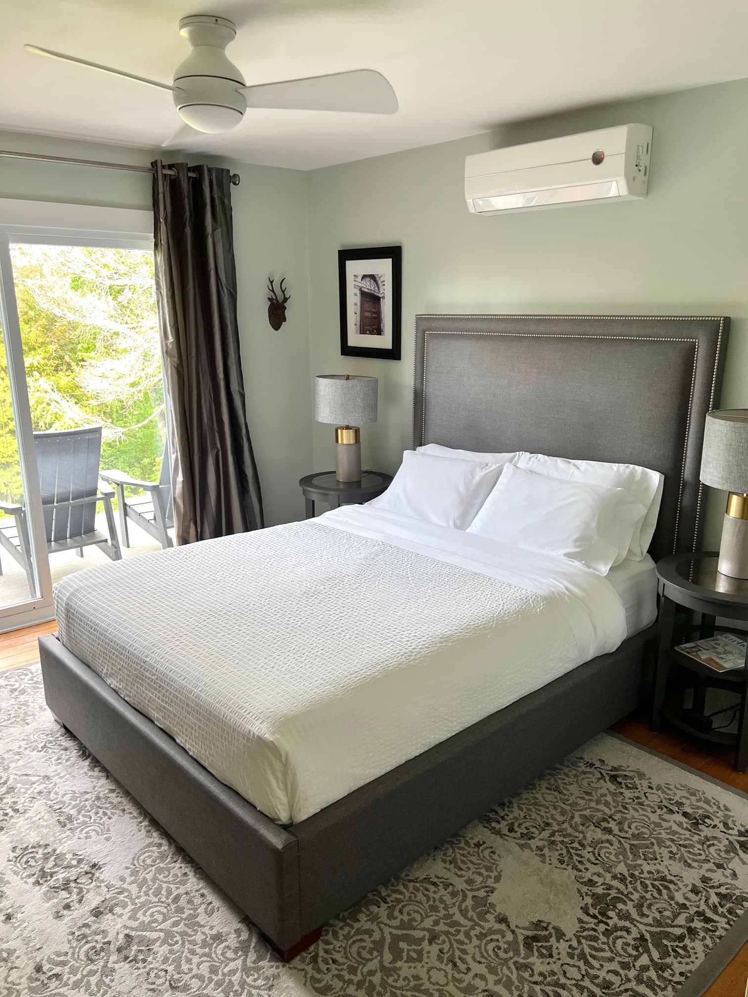 A spacious bedroom with a queen-sized bed