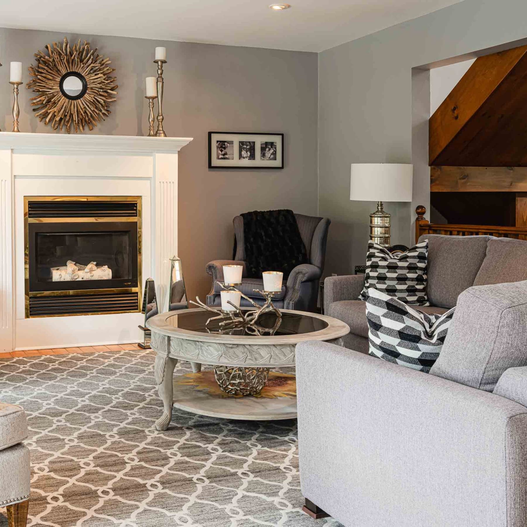 A cozy living room featuring a fireplace, comfortable seating, and tasteful decor.