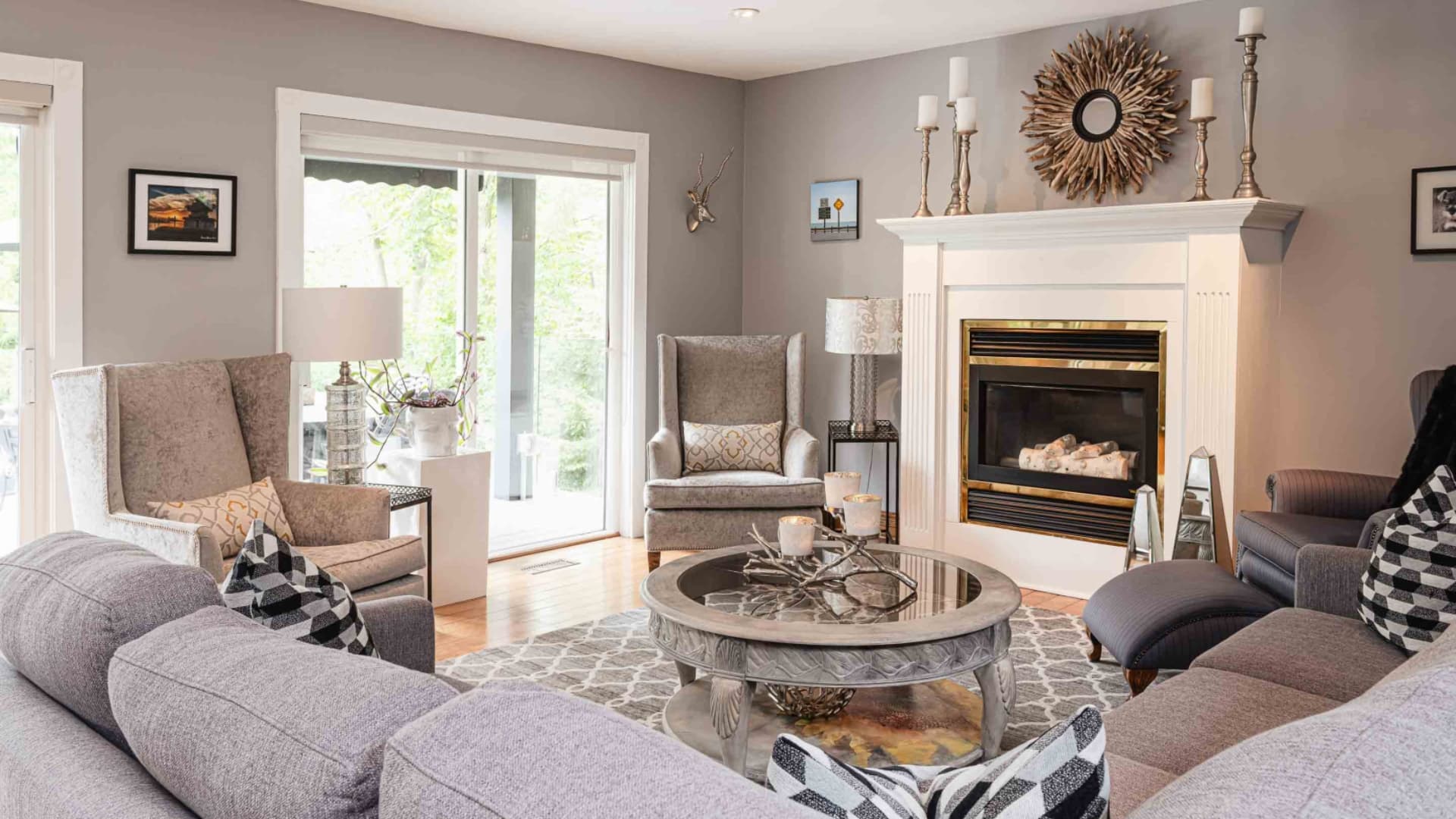 A stylish living room with comfortable seating, a fireplace, and elegant decor.