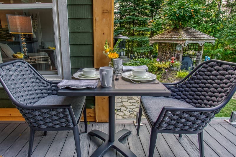 Patio chairs and table on raised patio deck