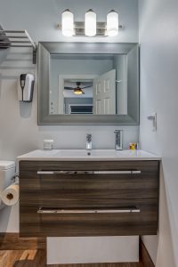 Birch Suite private ensuite bath with hand sanitizer and touchless soap dispenser.